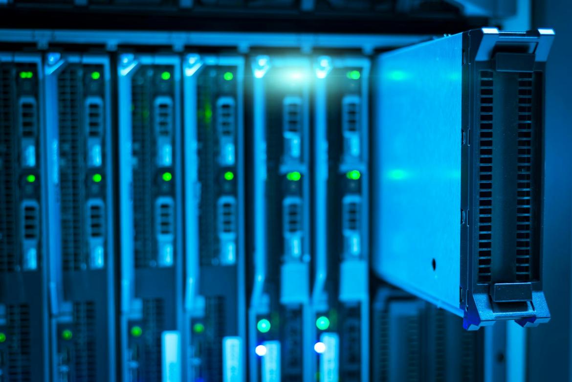 A rack of servers with on hard drive pulled out of its bay