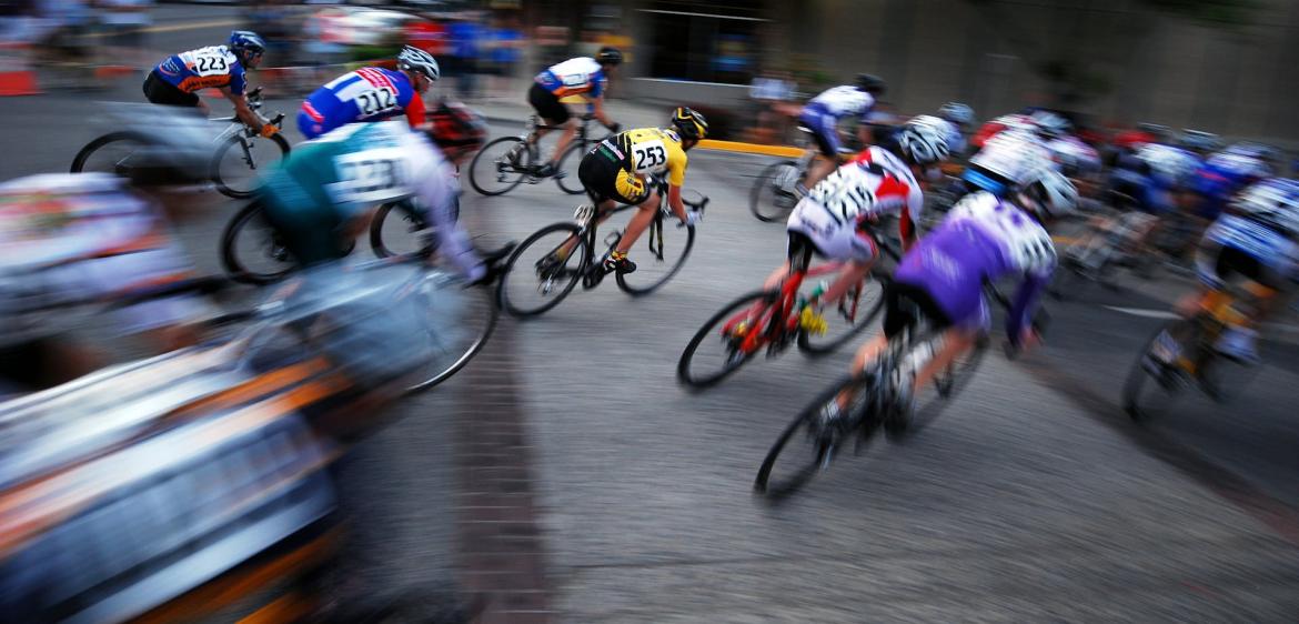 Bikers racing and grouped together, blurred at the edges