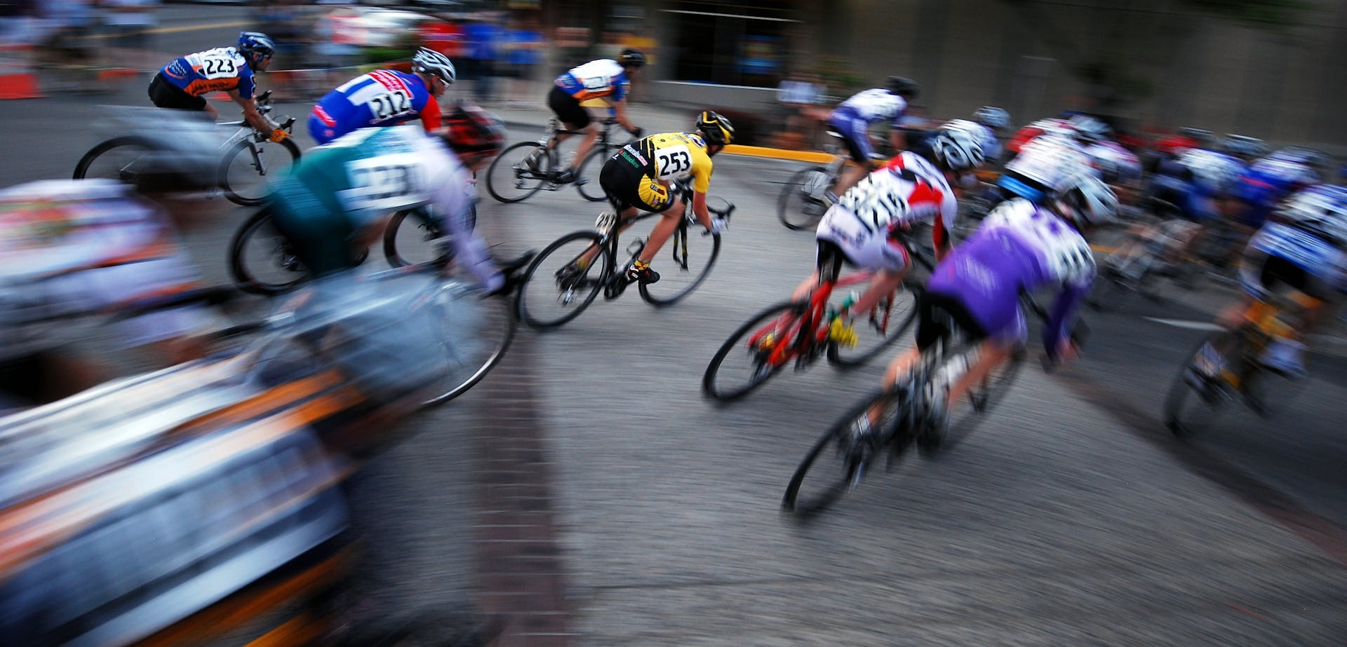 Bikers racing and grouped together, blurred at the edges