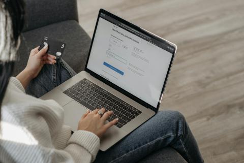 Woman making a payment on a laptop